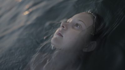 Girl Floating Calmly in Water