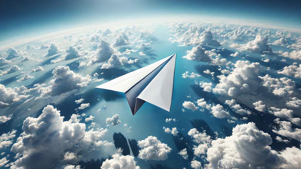 Paper Plane Soaring Above the Clouds