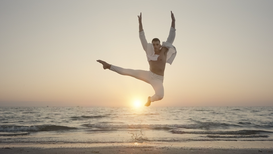 Dancer Leaping by the Ocean at Sunset