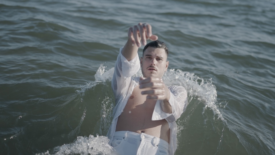 Person Leaning Back in Water with Focused Expression