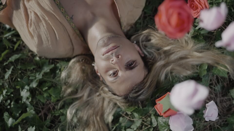 Slow Motion Falling Flowers on Face in Nature
