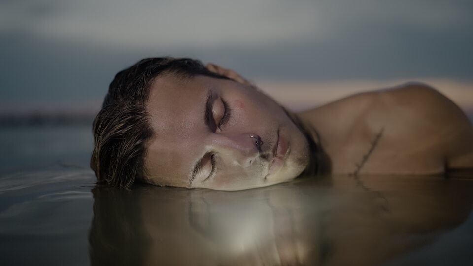 Peaceful Reflection in Water at Sunset