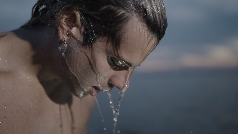 Slow Motion Water Dripping from Face