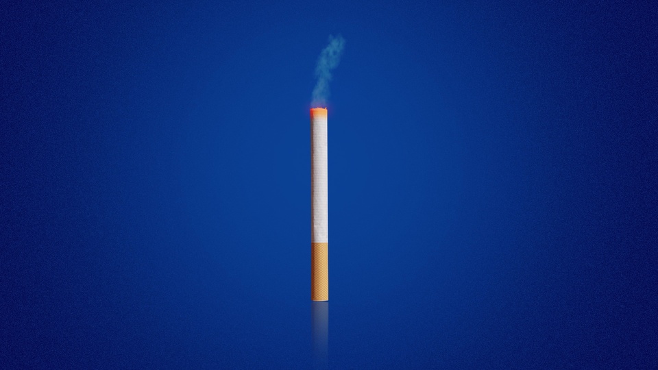 Burning Cigarette on Blue Background